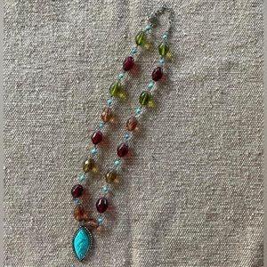 Multi colored necklace with turquoise pendant
